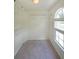 This walk-in closet features a window and multiple racks for storage at 5176 Shotwell St, Woodstock, GA 30188