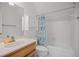 Bright bathroom featuring white cabinets, shower with curtain, tile floors, and updated vanity at 7045 Hunters Ne Knl, Sandy Springs, GA 30328