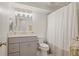 Modern bathroom features a vanity, stylish mirror, tiled shower, and good lighting at 7045 Hunters Ne Knl, Sandy Springs, GA 30328