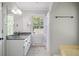 Bathroom featuring granite countertops, neutral tiling, and natural light at 7045 Hunters Ne Knl, Sandy Springs, GA 30328