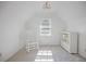 Attic bedroom showcasing bright walls, light carpet, and natural light at 7045 Hunters Ne Knl, Sandy Springs, GA 30328