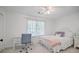 Bedroom with white walls, soft carpet, a desk and a full-sized bed at 7045 Hunters Ne Knl, Sandy Springs, GA 30328