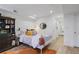 Bedroom featuring a large bed, stylish décor, and ample lighting, perfect for relaxation at 7045 Hunters Ne Knl, Sandy Springs, GA 30328