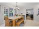 Sun-drenched dining area features French doors and a seamless transition to the adjacent living space at 7045 Hunters Ne Knl, Sandy Springs, GA 30328