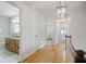 Bright hallway with hardwood floors leads to a bathroom and bedroom at 7045 Hunters Ne Knl, Sandy Springs, GA 30328