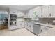 Modern kitchen with granite countertops, stainless steel appliances, and white cabinets provide a clean and stylish design at 7045 Hunters Ne Knl, Sandy Springs, GA 30328