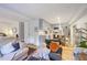 Open living area featuring a modern kitchen, bedroom area, and a comfortable living space at 7045 Hunters Ne Knl, Sandy Springs, GA 30328