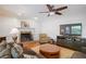 Inviting living room with a fireplace, hardwood floors, and comfortable furnishings at 7045 Hunters Ne Knl, Sandy Springs, GA 30328