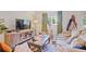 Inviting living room with a comfortable sofa, media center, a window, and stylish décor at 7045 Hunters Ne Knl, Sandy Springs, GA 30328