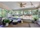 Spacious screened porch with comfortable furniture provides a perfect spot to relax while enjoying nature at 7045 Hunters Ne Knl, Sandy Springs, GA 30328
