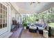 Relaxing screened porch with cozy seating offers an ideal space for enjoying outdoor living and entertaining at 7045 Hunters Ne Knl, Sandy Springs, GA 30328