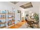 Charming dining room features hardwood floors, stylish shelving, and a view into a serene bedroom at 1166 Virginia Avenue Ne Ave # 8, Atlanta, GA 30306