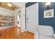 Stylish entryway boasts hardwood floors, a cozy armchair, and a view into a bright, open living space at 1166 Virginia Avenue Ne Ave # 8, Atlanta, GA 30306