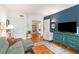 Charming living room features hardwood floors, a plush sofa, and a stylish accent wall at 1166 Virginia Avenue Ne Ave # 8, Atlanta, GA 30306