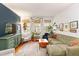 Cozy living room featuring hardwood floors, a comfortable sofa, and bright windows at 1166 Virginia Avenue Ne Ave # 8, Atlanta, GA 30306