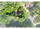 Aerial view of secluded home surrounded by mature trees at 3402 Devoe Ct, Marietta, GA 30062