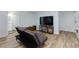 The modern finished basement features neutral walls, laminate floors, and flexible open living space at 3402 Devoe Ct, Marietta, GA 30062