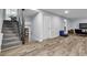 Finished basement features stylish flooring, staircase, and flexible living area with natural light at 3402 Devoe Ct, Marietta, GA 30062