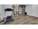Finished basement with a modern treadmill and ample storage shelving at 3402 Devoe Ct, Marietta, GA 30062