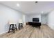 Finished basement area with modern flooring, wet bar and flexible living space with natural light at 3402 Devoe Ct, Marietta, GA 30062