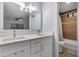 This bathroom boasts a double vanity, modern fixtures, and a tiled shower and bath combo at 3402 Devoe Ct, Marietta, GA 30062
