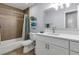 Well-lit bathroom with modern fixtures, white vanity, and shower with tile surround at 3402 Devoe Ct, Marietta, GA 30062