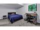 Cozy bedroom with a plush bed, a desk, and a window offering natural light at 3402 Devoe Ct, Marietta, GA 30062