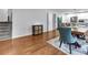 Dining area flowing into the updated kitchen featuring hardwood floors, access to the staircase, and an adjacent seating area at 3402 Devoe Ct, Marietta, GA 30062