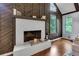 Cozy fireplace with stylish mantel and dark wood walls at 3402 Devoe Ct, Marietta, GA 30062