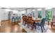 Kitchen and dining area featuring stainless appliances, white cabinets and a dining table with seating for six at 3402 Devoe Ct, Marietta, GA 30062