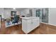 Open kitchen layout with a large island, dining table, and hardwood floors at 3402 Devoe Ct, Marietta, GA 30062