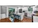 Modern kitchen featuring white cabinets, stainless steel appliances, and a center island with bar stool seating at 3402 Devoe Ct, Marietta, GA 30062