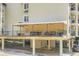 Elevated balcony area with black railings featuring outdoor dining and seating beneath a covered awning at 3655 Habersham Ne Rd # 344, Atlanta, GA 30305
