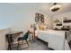 A loft bedroom with a queen bed, desk, and ceiling fan at 3655 Habersham Ne Rd # 344, Atlanta, GA 30305