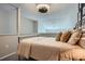 A view of the headboard with decorative pillows and a ceiling fan can be seen at 3655 Habersham Ne Rd # 344, Atlanta, GA 30305
