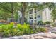 Lush landscaping surrounds this Habersham of Buckhead private residence with beautiful flowering plants and mature trees at 3655 Habersham Ne Rd # 344, Atlanta, GA 30305