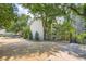 Exterior view of this Habersham of Buckhead residence, featuring mature trees and a private gated entry at 3655 Habersham Ne Rd # 344, Atlanta, GA 30305