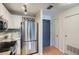 Bright kitchen features stainless steel appliances, white cabinets, marble countertops, and a wine rack at 3655 Habersham Ne Rd # 344, Atlanta, GA 30305