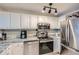Modern kitchen with sleek stainless steel appliances, countertops, and ample cabinet space, providing a functional and stylish cooking space at 3655 Habersham Ne Rd # 344, Atlanta, GA 30305