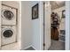 Hallway view of a stackable washer and dryer next to the entrance of a walk-in closet at 3655 Habersham Ne Rd # 344, Atlanta, GA 30305