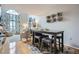 Open-concept living room featuring a dining area, comfortable seating, and a large window with natural light at 3655 Habersham Ne Rd # 344, Atlanta, GA 30305