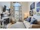 Spacious living room featuring a fireplace, large windows, and stylish furnishings, offering a comfortable and elegant living space at 3655 Habersham Ne Rd # 344, Atlanta, GA 30305