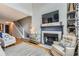 Spacious living room showcases fireplace, hardwood floors and stairs leading to the second floor at 3655 Habersham Ne Rd # 344, Atlanta, GA 30305