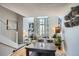 Open-concept living space with stairs, dining, fireplace, natural light, and a modern decor, creating a welcoming and spacious environment at 3655 Habersham Ne Rd # 344, Atlanta, GA 30305