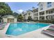 Community pool and bathhouse with surrounding lounge chairs and lush landscaping under sunny skies at 3655 Habersham Ne Rd # 344, Atlanta, GA 30305