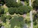 Aerial view captures a home with mature trees in a neighborhood setting at 434 Terrace Sw Dr, Smyrna, GA 30082