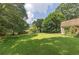 Spacious backyard with green lawn and mature trees, perfect for outdoor activities at 434 Terrace Sw Dr, Smyrna, GA 30082