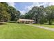 View of a well kept front lawn of a cozy single-story home with a carport at 434 Terrace Sw Dr, Smyrna, GA 30082