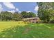 Wide angle view of a single story home sitting on a grassy lot surrounded by mature trees at 434 Terrace Sw Dr, Smyrna, GA 30082