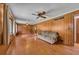 Spacious living room with wood-paneled walls, two ceiling fans, and a comfortable couch at 434 Terrace Sw Dr, Smyrna, GA 30082